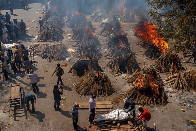 Multiple funeral pyres of victims of COVID 19