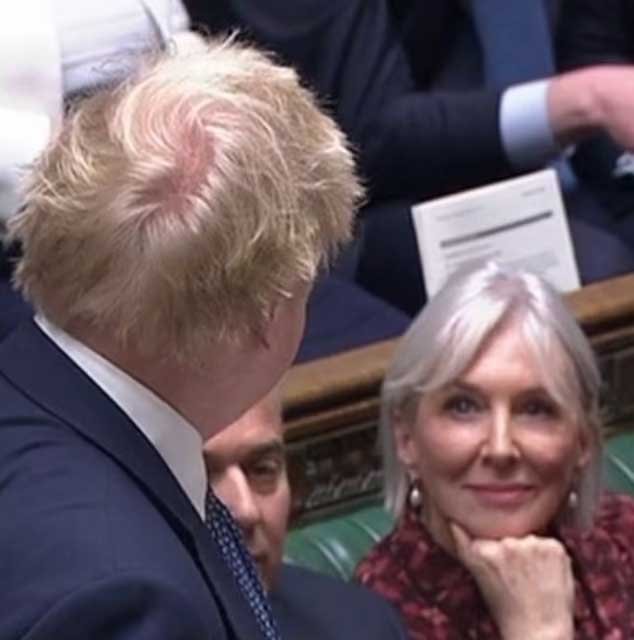 Nadine Dorries looks at Boris Johnson