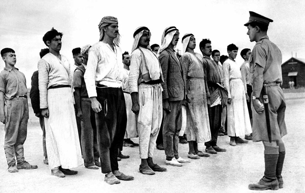 These Arab recruits line up in a barracks square in the British Mandate of Palestine